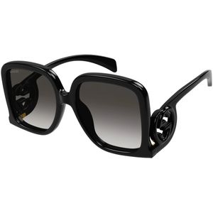 Óculos de sol Gucci para senhora em acetato preto com linha dourada no  rebordo da lente.